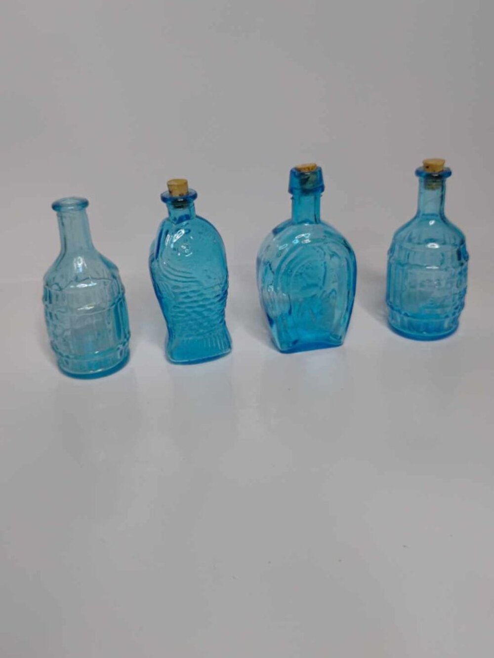 Vintage small blue bottles set